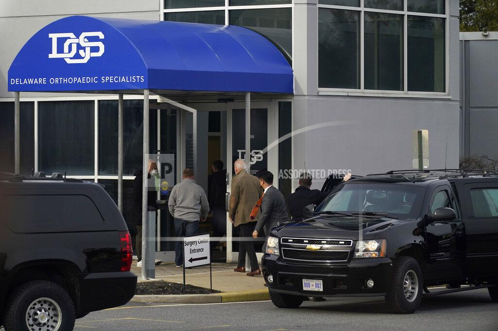 Patrick Semansky President Joe Biden, center, steps out of a motorcade vehicle as he arrives for an orthopaedic appointment, Saturday, Feb. 6, 2021, in Newark, Del. Biden fractured his right foot while playing with one of his dogs in November. (AP Photo/Patrick Semansky)