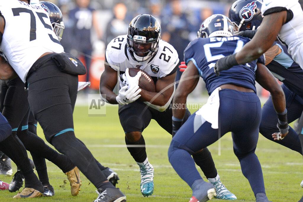 Mark Zaleski Jacksonville Jaguars running back Leonard Fournette (27) carries the ball against the Tennessee Titans in the first half of an NFL football game Sunday, Nov. 24, 2019, in Nashville, Tenn. (AP Photo/Mark Zaleski)