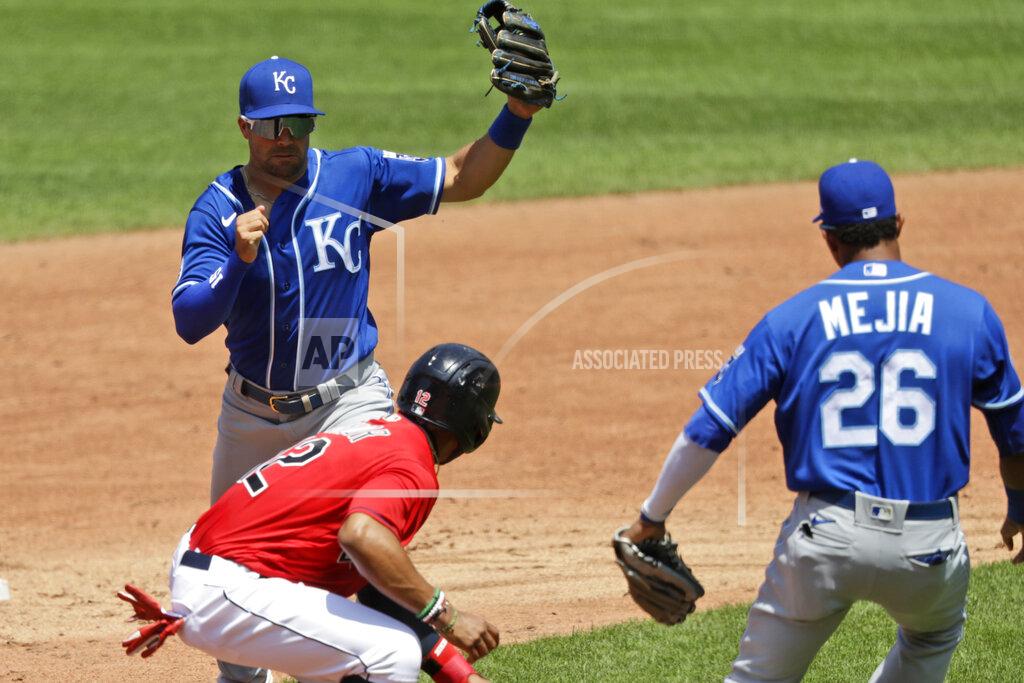 Tony Dejak Cleveland Indians' Francisco Lindor, center, is caught in a rundown between Kansas City Royals' Whit Merrifield, back, and Erick Mejia in the third inning in a baseball game Sunday, July 26, 2020, in Cleveland. Lindor was out on the play. (AP Photo/Tony Dejak)