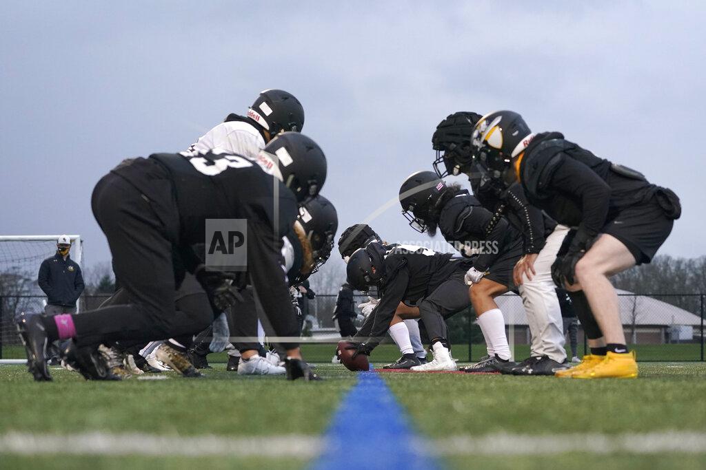 Ted S. Warren Pacific Lutheran football players wait for the snap on the line of scrimmage during practice Tuesday, Feb. 2, 2021, in Tacoma, Wash. For all the attention heaped on the FBS level of college football last fall as it tried to play, it will not be the only college football during the 2020-21 sports calendar as a handful of NCAA Division III and NAIA programs begin some form of a winter/spring season Saturday, Feb. 6. (AP Photo/Ted S. Warren)