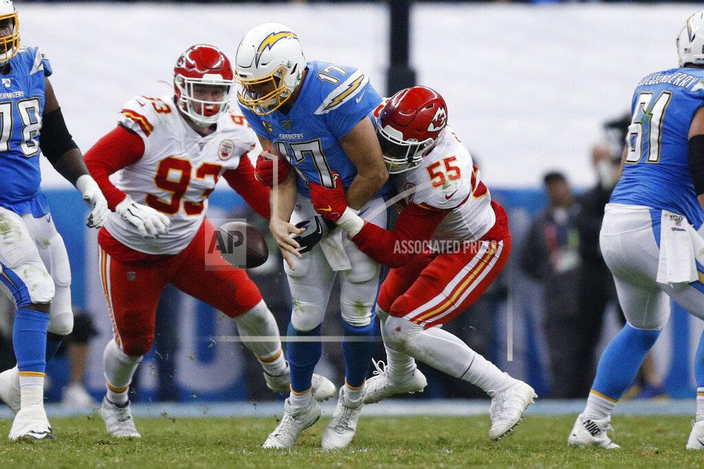 Rebecca Blackwell Los Angeles Chargers quarterback Philip Rivers, center, is sacked by Kansas City Chiefs defensive end Frank Clark (55) and defensive tackle Joey Ivie (93) during the second half of an NFL football game Monday, Nov. 18, 2019, in Mexico City. (AP Photo/Rebecca Blackwell)