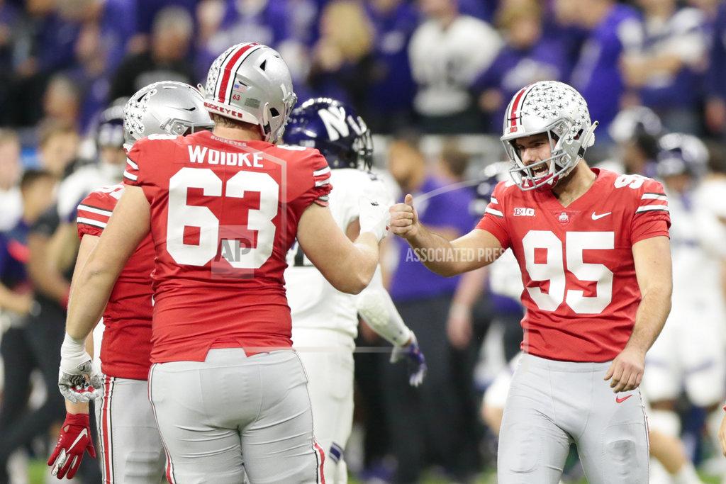 Aj Mast Ohio State place kicker Blake Haubeil (95) is congratulated on a 42-yard field goal by Kevin Woidke (63) during the first half of the Big Ten championship NCAA college football game against Northwestern, Saturday, Dec. 1, 2018, in Indianapolis. (AP Photo/AJ Mast)