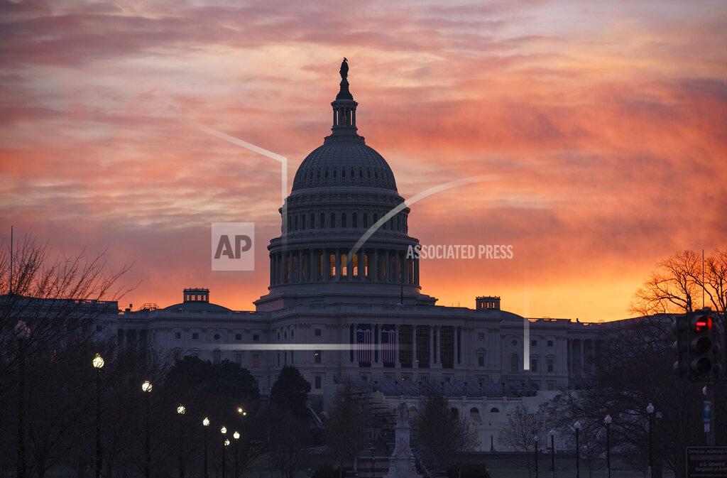 J. Scott Applewhite Dawn breaks at the Capitol in Washington, Monday, Jan. 11, 2021. House Speaker Nancy Pelosi, D-Calif., is calling for congressional action to rein in President Donald Trump after inciting last week's deadly assault on the U.S. Capitol. (AP Photo/J. Scott Applewhite)