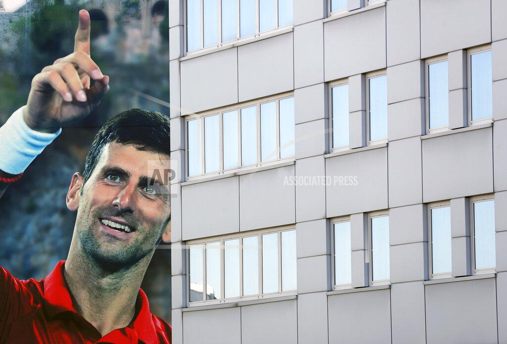 Darko Vojinovic A huge billboard depicting Serbian tennis player Novak Djokovic on a building in Belgrade, Serbia, Wednesday, June 24, 2020. Djokovic has tested positive for the coronavirus after taking part in a tennis exhibition series he organized in Serbia and Croatia. The top-ranked Serb is the fourth player to test positive for the virus after first playing in Belgrade and then again last weekend in Zadar, Croatia. (AP Photo/Darko Vojinovic)