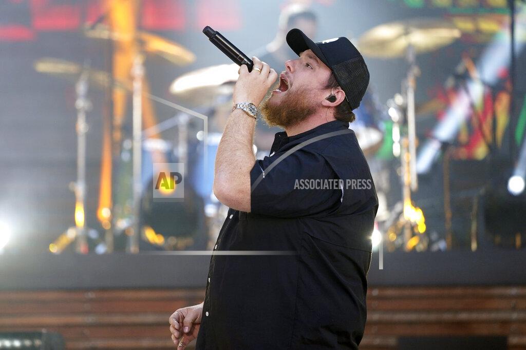 Mark Humphrey FILE - In this May 13, 2021, file photo, Luke Combs performs at the CMT Music Awards in Nashville, Tenn. Combs is paying the funeral expenses of three young men who saw him perform at a Michigan event before they died from accidental carbon monoxide poisoning at a nearby campground, relatives said. (AP Photo/Mark Humphrey, File)