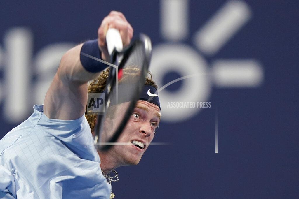 Wilfredo Lee Andrey Rublev, of Russia, serves to Tennys Sandgren during the Miami Open tennis tournament, Saturday, March 27, 2021, in Miami Gardens, Fla. (AP Photo/Wilfredo Lee)