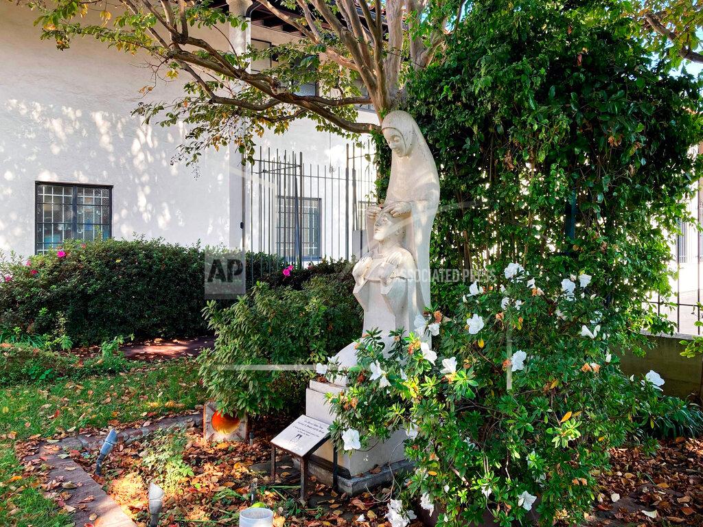 Alejandra Molina A statue "Our Blessed Mother Mary Inspiring St. Dominic with the Rosary" stands at the Monastery of the Angels chapel is shown Dec. 8, 2021, in Los Angeles. Fearing the Monastery of the Angels could be sold for private use or redevelopment, Los Angeles preservationists and advocates are forming a nonprofit as they seek to acquire and take responsibility for the beloved Hollywood home to cloistered Dominican nuns. (Alejandra Molina/Religion New Service via A)