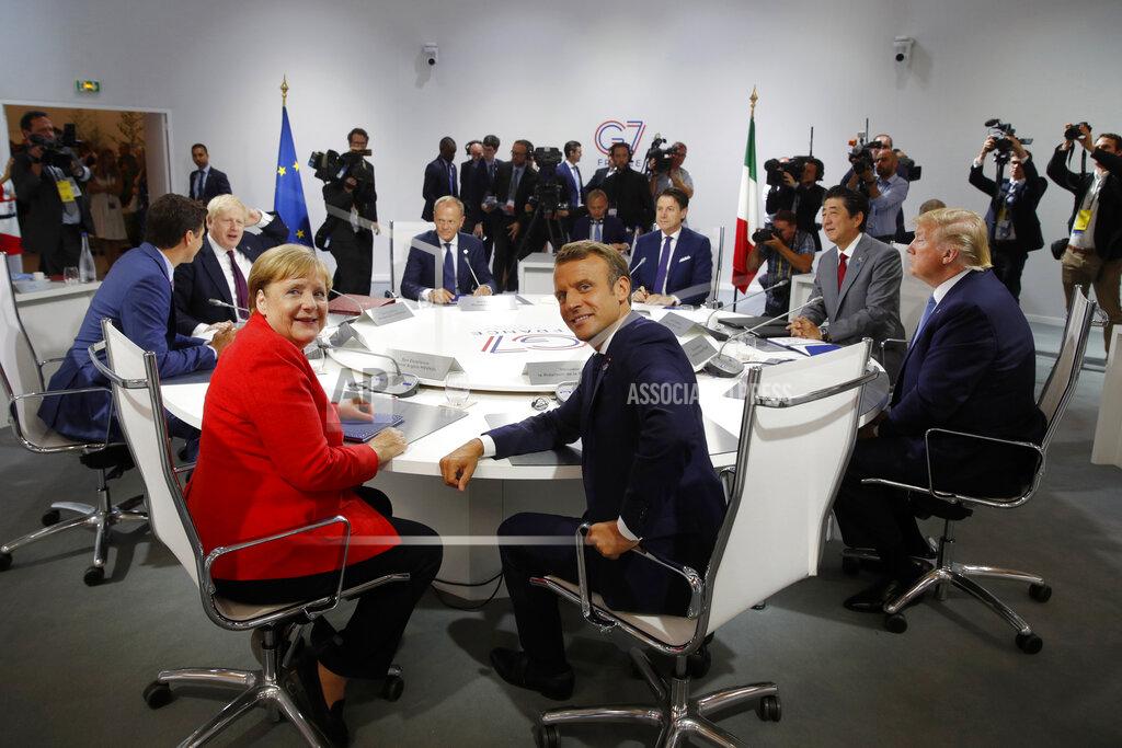 Philippe Wojazer FILE - In this Aug. 25, 2019, file photo, French President Emmanuel Macron, center, U.S. President Donald Trump, right, Japan's Prime Minister Shinzo Abe, second right, Britain's Prime Minister Boris Johnson, second left, German Chancellor Angela Merkel , center left, Canada's Prime Minister Justin Trudeau, Italy's Prime Minister Giuseppe Conte, rear right, and European Council President Donald Tusk attend a session during the G7 summit in Biarritz, southwestern France. Helping countries recover from the coronavirus pandemic will be at the top of the agenda for the Group of Seven summit when Johnson welcomes President Joe Biden and the leaders of France, Germany, Italy, Japan and Canada to the cliff-ringed Carbis Bay beach resort in southwestern England on Friday, June 11. (Philippe Wojazer/Pool via AP, File)