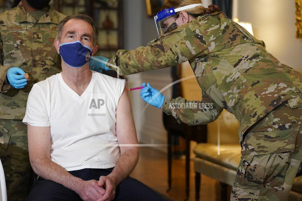 Steve Helber Virginia Gov. Ralph Northam receives a COVID-19 vaccination from Lt. Col. Kris Clark, of the Virginia Air National Guard at the Governor's Mansion in Richmond, Va., Monday, March 15, 2021. Northam got a shot of the Johnson & Johnson coronavirus vaccine, joining the growing number of Virginians who are being inoculated against the potentially deadly disease. (AP Photo/Steve Helber)