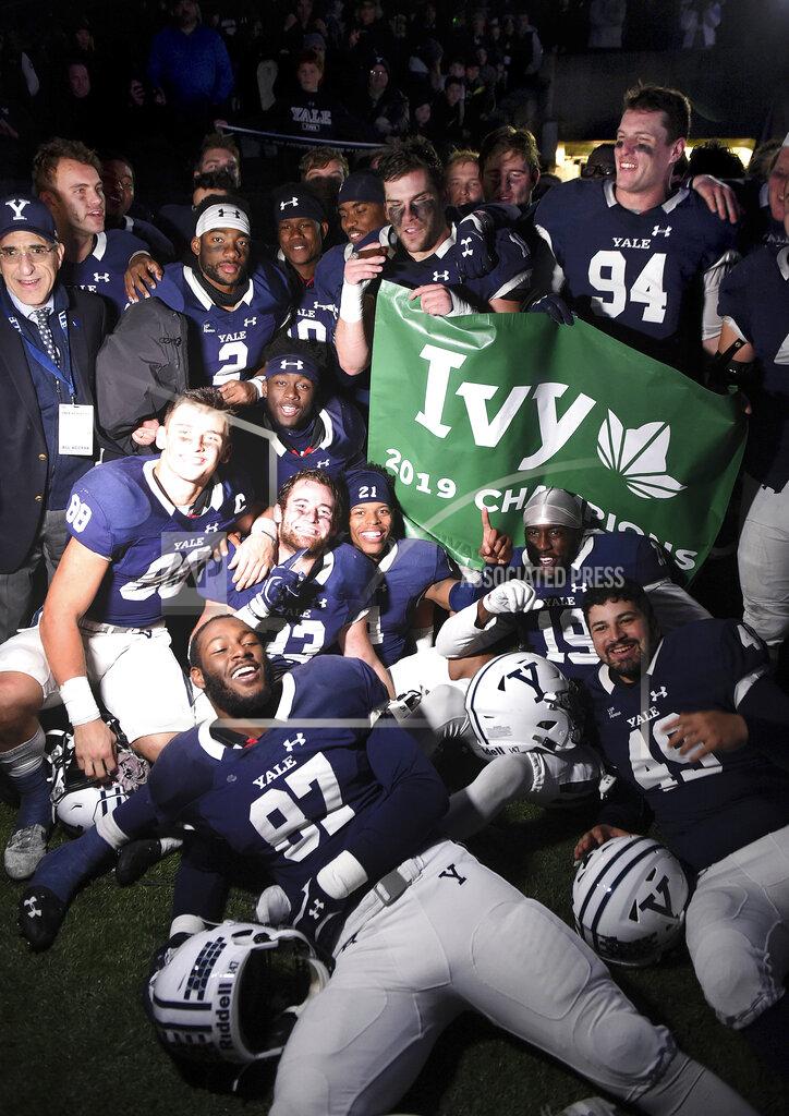 Arnold Gold Yale players celebrate winning the Ivy League after their 50-43 double overtime victory against Harvard in an NCAA college football game at the Yale Bowl, Saturday, Nov. 23, 2019, in New Haven, Conn. (Arnold Gold/New Haven Register via AP)