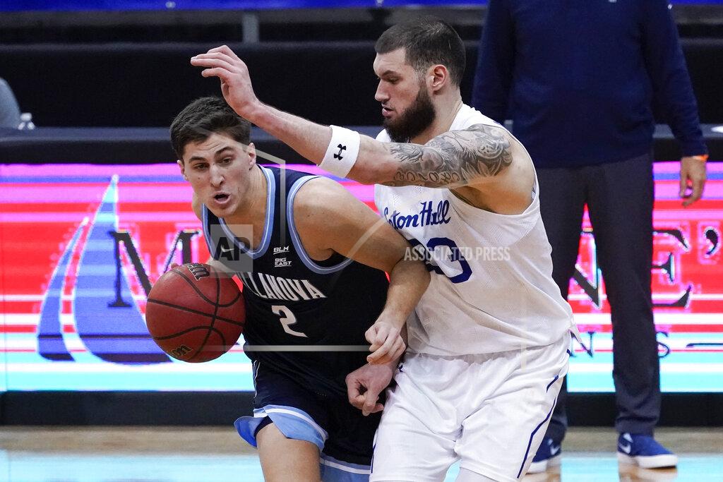 Mary Altaffer Villanova guard Collin Gillespie (2) drives against Seton Hall forward Sandro Mamukelashvili (23) during the second half of an NCAA college basketball game, Saturday, Jan. 30, 2021, in Newark, N.J. (AP Photo/Mary Altaffer)