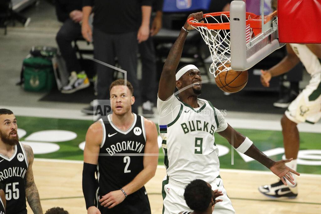 Aaron Gash Milwaukee Bucks' Bobby Portis dunks during the first half of an NBA basketball game against the Brooklyn Nets Tuesday, May 4, 2021, in Milwaukee. (AP Photo/Aaron Gash)