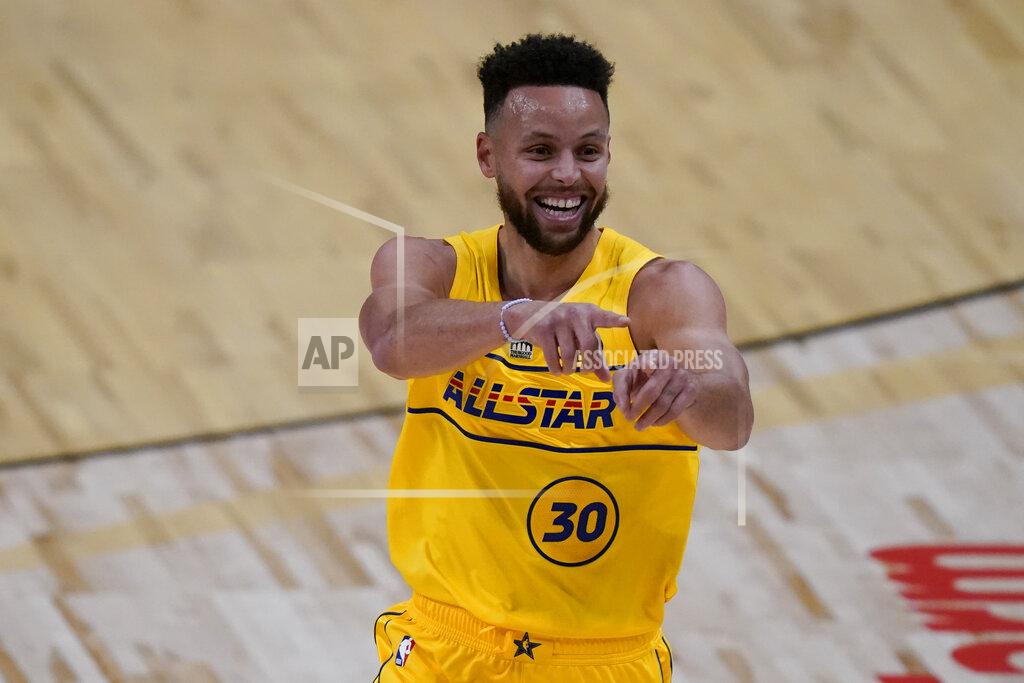 Brynn Anderson Golden State Warriors guard Stephen Curry celebrates after scoring during the first half of basketball's NBA All-Star Game in Atlanta, Sunday, March 7, 2021. (AP Photo/Brynn Anderson)
