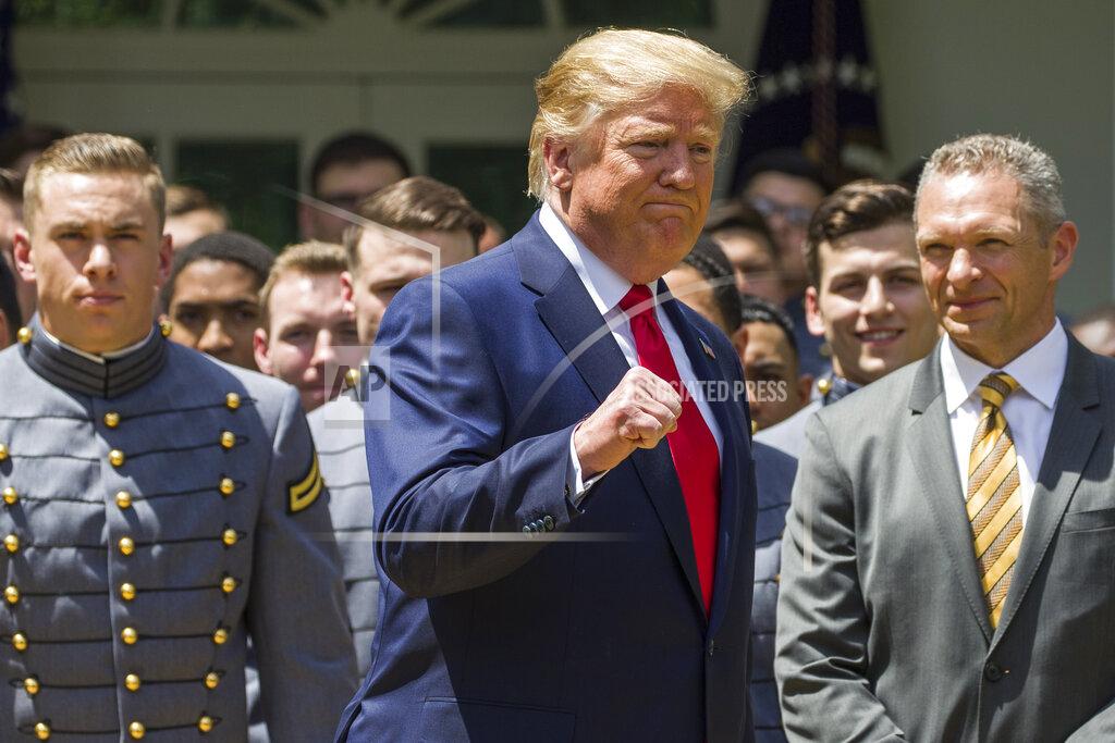 Alex Brandon President Donald Trump pumps his fist as he departs after the presentation of the Commander-in-Chief's Trophy to the U.S. Military Academy at West Point football team, in the Rose Garden of the White House, Monday, May 6, 2019, in Washington. (AP Photo/Alex Brandon)