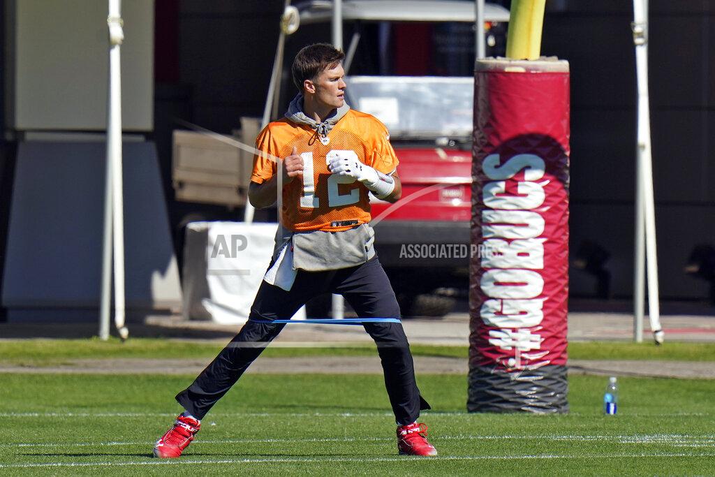 Tampa Bay Buccaneers quarterback Tom Brady (12) runs with an elastic band around his legs during an NFL football workout Thursday, Jan. 28, 2021, in Tampa, Fla. The Buccaneers play the Kansas City Chiefs in Super Bowl LV on Feb. 7. (AP Photo/Chris O'Meara)