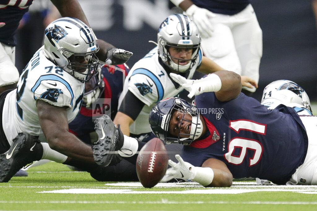 Michael Wyke Houston Texans defensive end Carlos Watkins (91) reaches for the ball after Carolina Panthers quarterback Kyle Allen (7) fumbled during the first half of an NFL football game Sunday, Sept. 29, 2019, in Houston. (AP Photo/Michael Wyke)