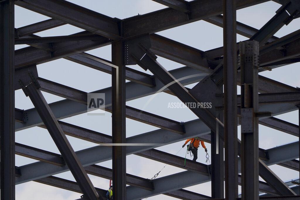 Chris Carlson Construction personnel work on Carolina Panthers' state-of-the-art team headquarters and practice facility Tuesday, Aug. 24, 2021, in Rock Hill, S.C. "The Rock" will host all of the team's offices and training/locker room facilities, along with three outdoor grass practice fields, one indoor artificial field and another outdoor artificial field that is part of a 5,000-seat multipurpose stadium that can also be used to host high school football and soccer games, concerts, car shows and much more. (AP Photo/Chris Carlson)