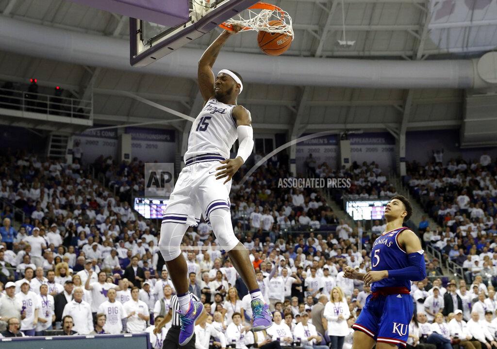 Tony Gutierrez TCU forward JD Miller (15) dunks the ball after getting past Kansas guard Quentin Grimes (5) in the second half of an NCAA college basketball game in Fort Worth, Texas, Monday, Feb. 11, 2019. (AP Photo/Tony Gutierrez)