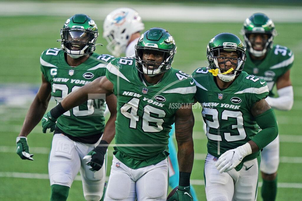Corey Sipkin New York Jets' Neville Hewitt, center, celebrates a fumble recovery during the second half of an NFL football game against the Miami Dolphins, Sunday, Nov. 29, 2020, in East Rutherford, N.J. (AP Photo/Corey Sipkin)