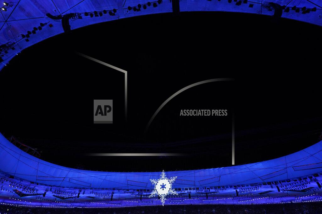 Jae C. Hong The Olympic flame burns in the center of the snowflake-shaped cauldron during the closing ceremony of the 2022 Winter Olympics, Sunday, Feb. 20, 2022, in Beijing. (AP Photo/Jae C. Hong)