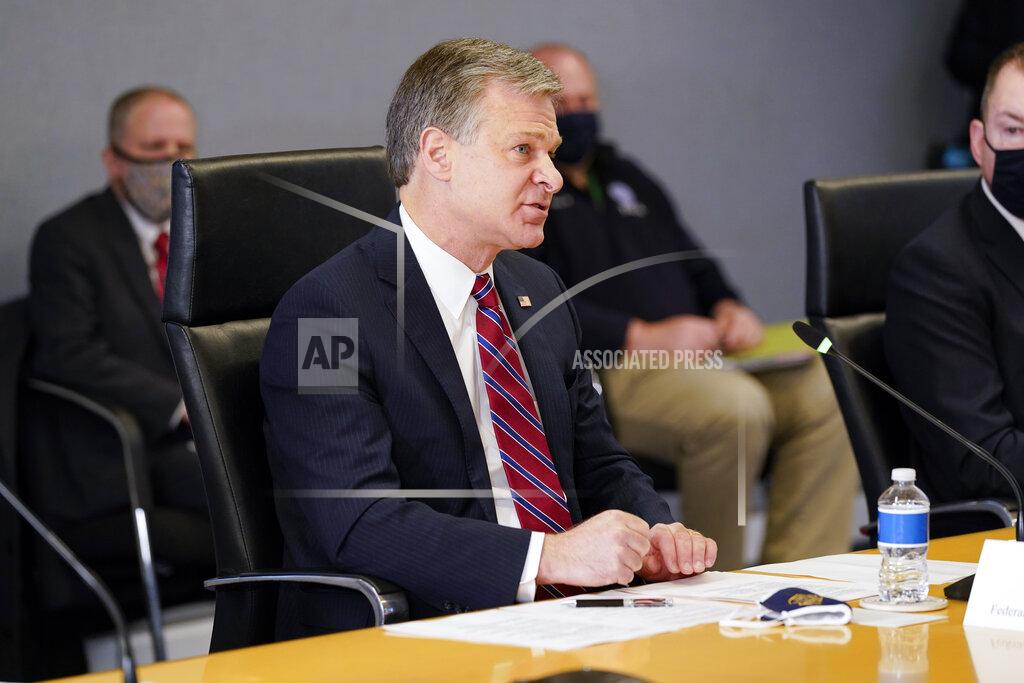 Alex Brandon FBI Director Christopher Wray speaks during a briefing about the upcoming presidential inauguration of President-elect Joe Biden and Vice President-elect Kamala Harris, at FEMA headquarters, Thursday, Jan. 14, 2021, in Washington. (AP Photo/Alex Brandon, Pool)