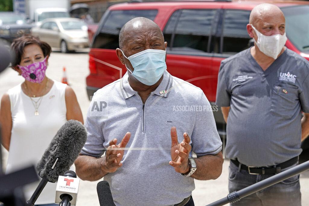 FILE - In this June 28, 2020 file photo, Houston Mayor Sylvester Turner speaks in Houston. Houston officials have canceled the Texas GOP's in-person convention. They say the spread of the coronavirus made it impossible to hold the event as scheduled. Mayor Turner said Wednesday, July 8, 2020, that the city's lawyers exercised provisions in the contract that the Texas Republican Party signed to rent the downtown convention center for a three-day event to have started July 16. Virus cases have surged in Texas, particularly in the state's largest cities. (AP Photo/David J. Phillip File)