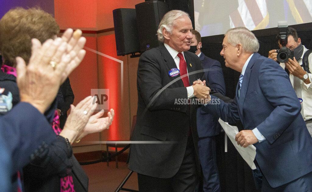 Tracy Glantz Sen. Lindsey Graham, right R-S.C, greets South Carolina Gov. Henry McMaster after winning re-election, Tuesday, Nov. 3, 2020, in Columbia, S.C. (Tracy Glantz/The State via AP)
