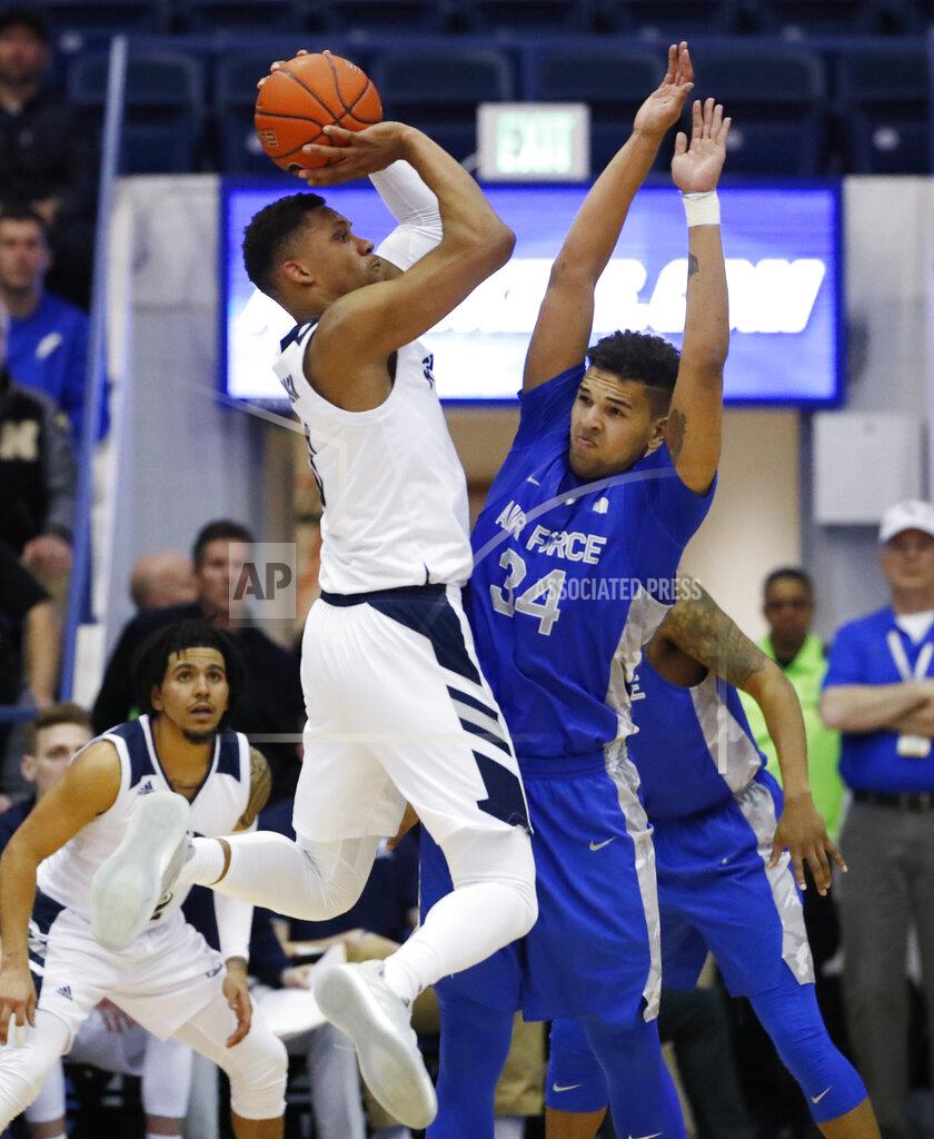 David Zalubowski Nevada forward Tre'Shawn Thurman, left, hoists a shot over Air Force forward Ryan Swan for a basket during the second half of an NCAA college basketball game Tuesday, March 5, 2019, at Air Force Academy, Colo. Nevada won 90-79. (AP Photo/David Zalubowski)