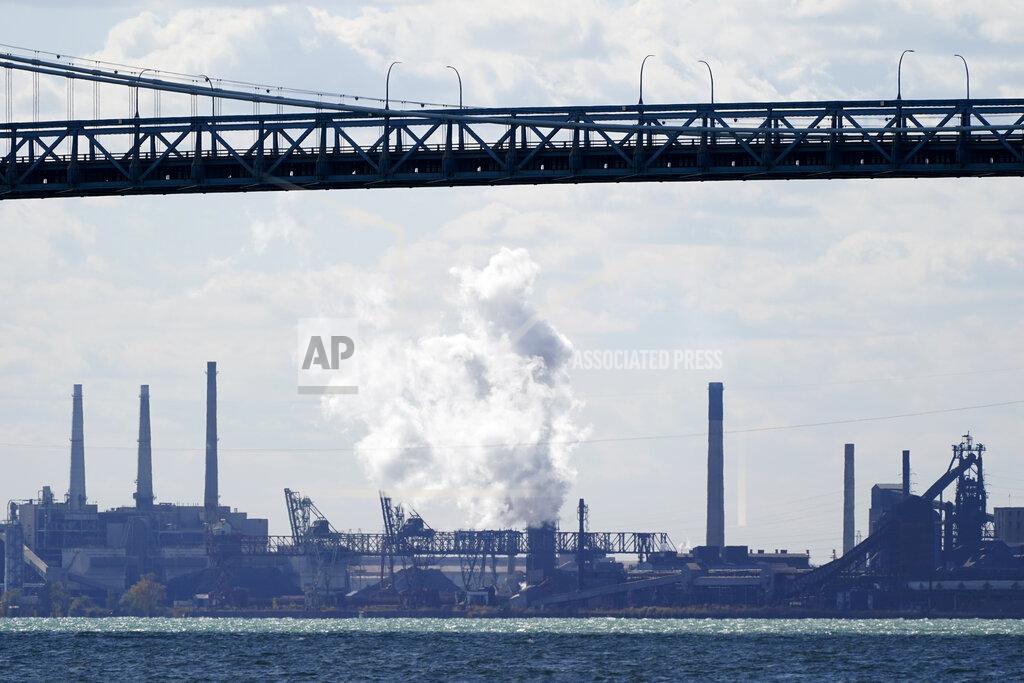 Carlos Osorio Zug Island, a heavily industrialized island at the southern city limits of Detroit is seen, Friday, Oct. 16, 2020, in Detroit. The area in Southwest Detroit has been the subject of numerous air pollution and public health studies. The area has a refinery, a coal-fired power plant, steel mills and other industrial sites. (AP Photo/Carlos Osorio)