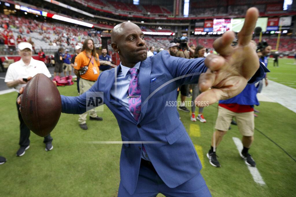 Ross D. Franklin NFL hall of famer Jerry Rice throws the football prior an NFL football game between the Seattle Seahawks and the Arizona Cardinals, Sunday, Sept. 29, 2019, in Glendale, Ariz. (AP Photo/Ross D. Franklin)