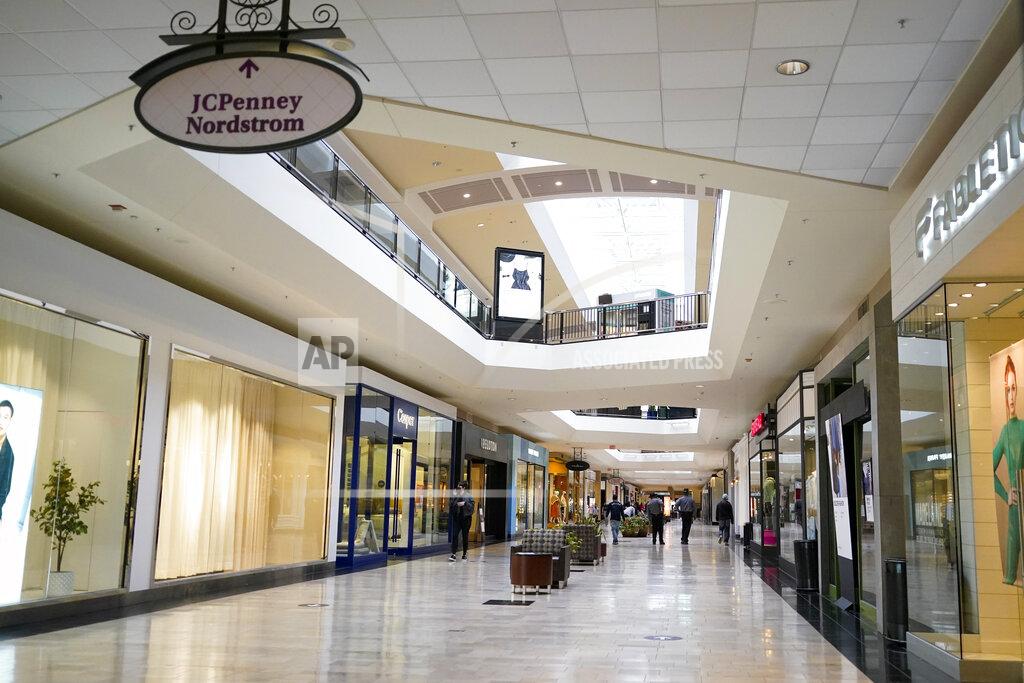 Keith Srakocic In this photo made on Wednesday, Feb. 24, 2021, people walks through a shopping mall in Pittsburgh. The pandemic emptied malls and restaurants and accelerated a trend toward online ordering and delivery. It’s not yet clear if shoppers and diners will ever return to their old habits. (AP Photo/Keith Srakocic)
