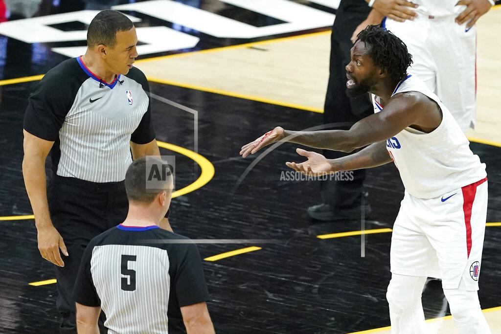 Matt York Los Angeles Clippers guard Patrick Beverley, right, shows officials blood on his hand as he reacts after being called for a foul on Phoenix Suns guard Devin Booker during the second half of Game 2 of the NBA basketball Western Conference Finals, Tuesday, June 22, 2021, in Phoenix. (AP Photo/Matt York)