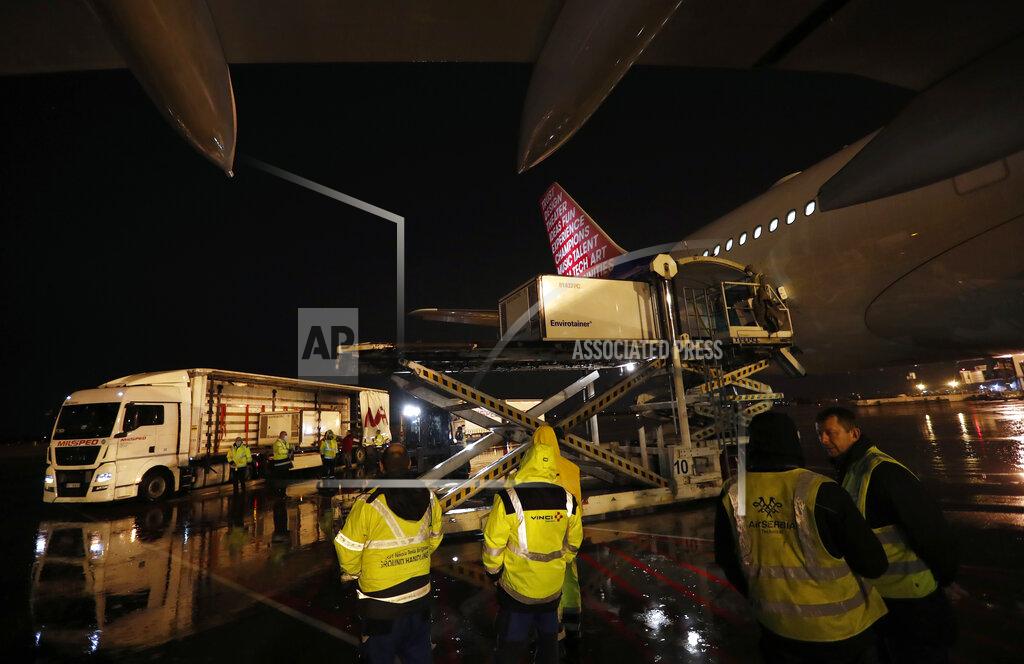 Darko Vojinovic FILE - In this Wednesday, Feb. 10, 2021 file photo, workers unload a container of China's Sinopharm coronavirus vaccines at the Belgrade Airport in Serbia. China is providing the vaccine to countries such as Serbia and Hungary -- a significant geopolitical victory in Central Europe and the Balkans, where the West, China and Russia are competing for political and economic influence. (AP Photo/Darko Vojinovic)