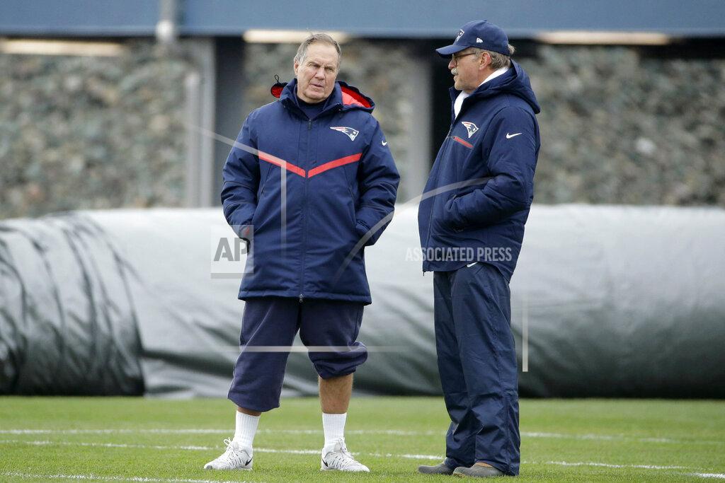 Steven Senne FILE — New England Patriots head coach Bill Belichick, left, speaks with football research director Ernie Adams, right, during an NFL football team practice, in this Wednesday, Dec. 7, 2016 file photo, in Foxborough, Mass. Adams, a former high school classmate of Belichick, participated in his final practice with the team Wednesday, June 16, 2021. Adams retired from his job at the Patriots, Wednesday, June 16, after 21 years with the team. (AP Photo/Steven Senne, File)