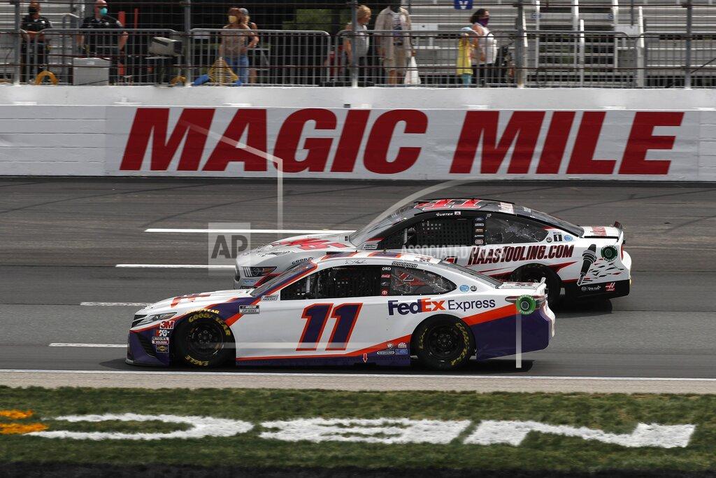 Charles Krupa Drivers Denny Hamlin (11) and Cole Custer, rear, race side-by-side during a NASCAR Cup Series auto race, Sunday, Aug. 2, 2020, at the New Hampshire Motor Speedway in Loudon, N.H. (AP Photo/Charles Krupa)