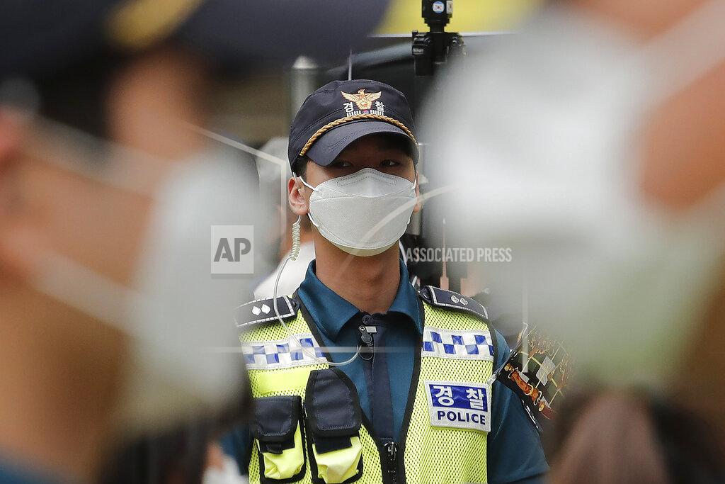 Ahn Young-Joon Police officers wearing face masks to help protect against the spread of the new coronavirus stand guard near the Japanese embassy in Seoul, South Korea, Wednesday, July 1, 2020. (AP Photo/Ahn Young-joon)