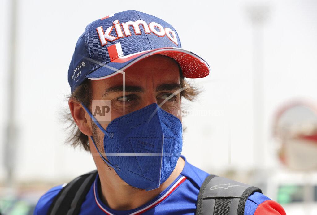 Kamran Jebreili Alpine F1 team driver Fernando Alonso from Spain arrives to the Bahrain International Circuit, in Sakhir, Bahrain, Thursday, March 25, 2021. Bahrain F1 race will be March 28. (AP Photo/Kamran Jebreili)