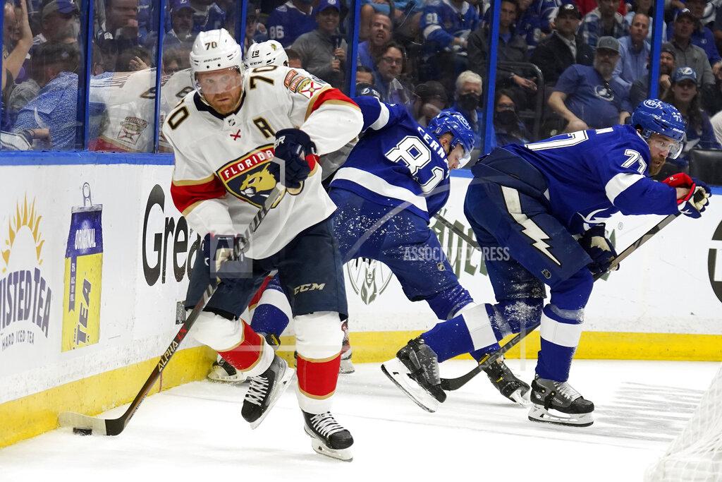 Chris O'MEara Florida Panthers right wing Patric Hornqvist (70) carries the puck ahead of Tampa Bay Lightning defenseman Victor Hedman (77) and defenseman Erik Cernak (81) during the first period in Game 4 of an NHL hockey second-round playoff series Monday, May 23, 2022, in Tampa, Fla. (AP Photo/Chris O'Meara)