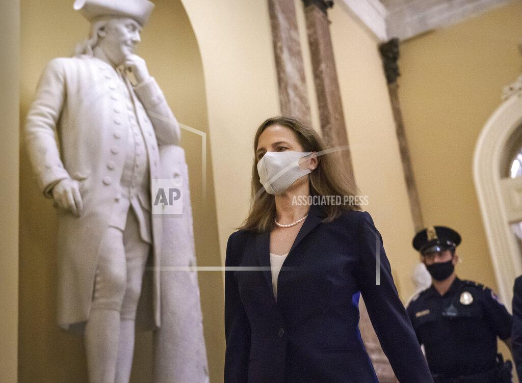 J. Scott Applewhite Judge Amy Coney Barrett, President Donald Trump's nominee for the Supreme Court, arrives for closed meetings with senators, at the Capitol in Washington, Wednesday, Oct. 21, 2020. (AP Photo/J. Scott Applewhite)