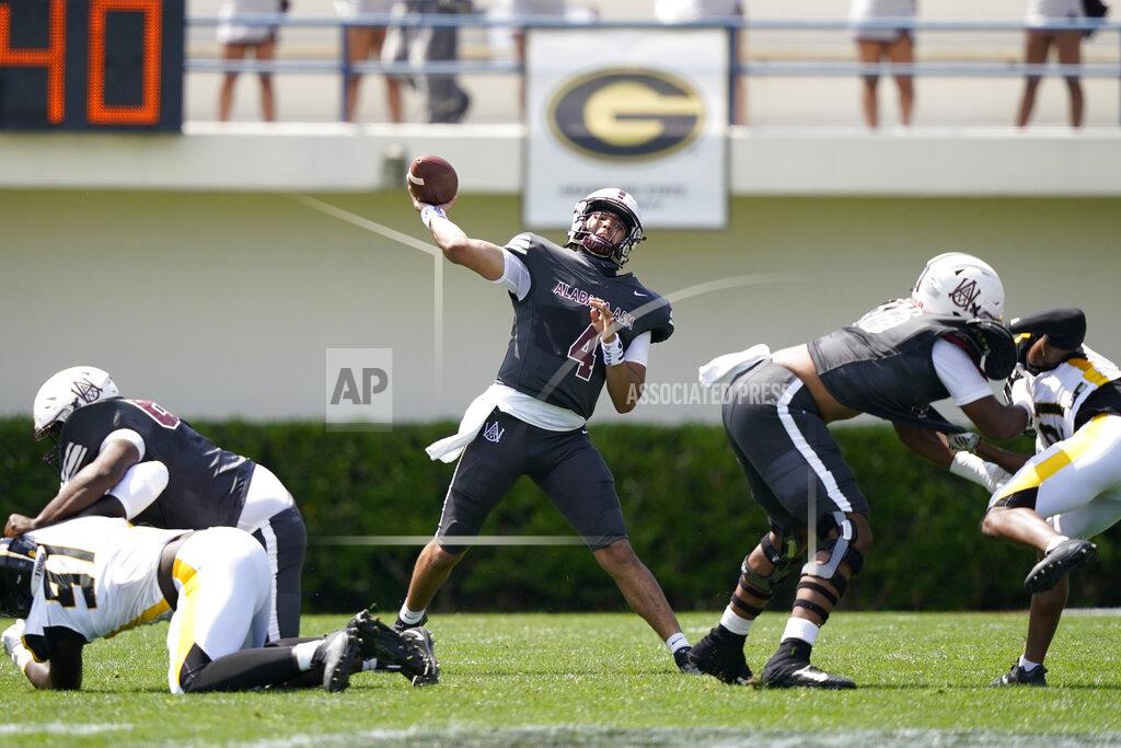 Rogelio V. Solis Alabama A&M quarterback Aqeel Glass (4) passes against Arkansas-Pine Bluff during the first half of the Southwestern Athletic Conference NCAA college football game, Saturday, May 1, 2021, in Jackson, Miss. (AP Photo/Rogelio V. Solis)