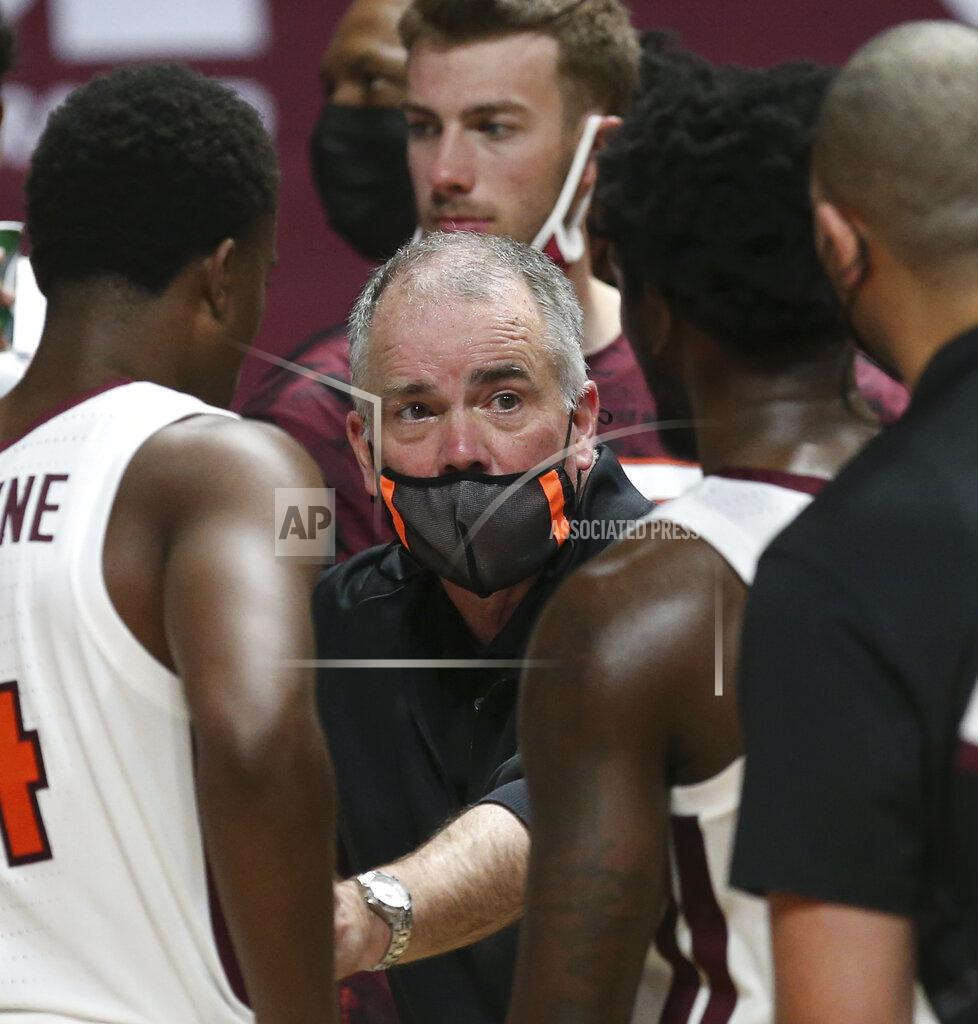 Matt Gentry Virginia Tech head coach Mike Young speaks with his team during a timeout during the second half of an NCAA college basketball game against VMI, Thursday, Dec. 3, 2020 in Blacksburg, Va. (Matt Gentry/The Roanoke Times via AP, Pool)