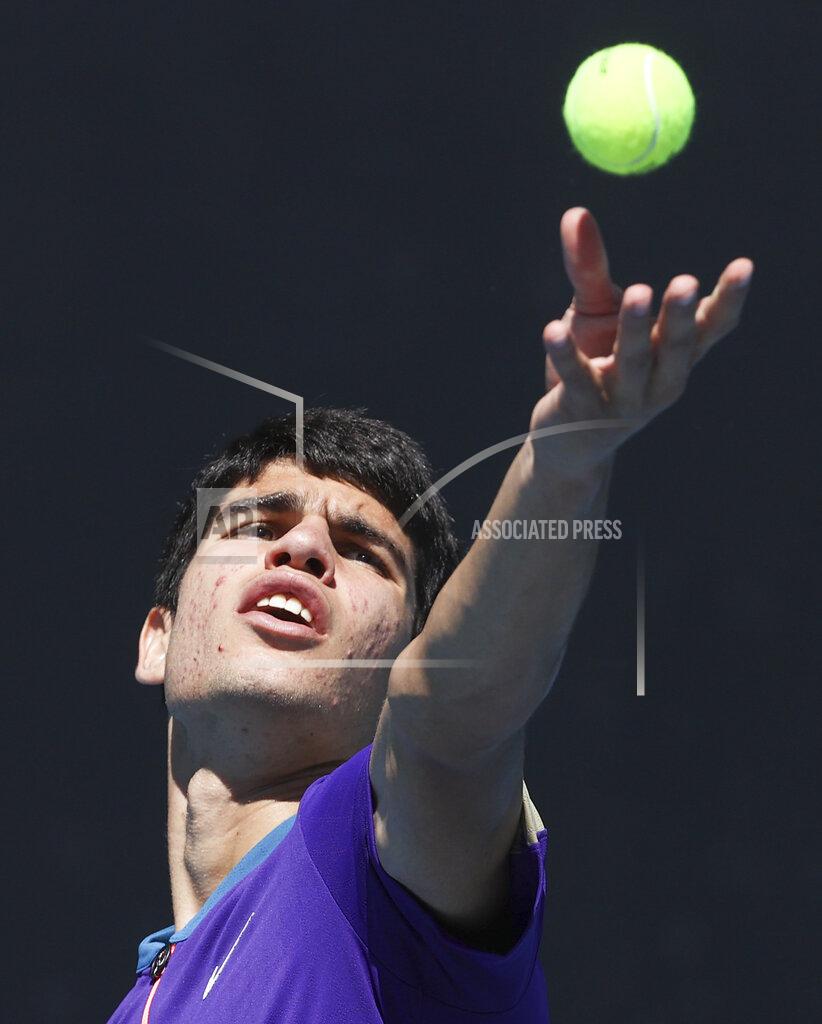 Hamish Blair Spain's Carlos Alcaraz serves to Botic Van de Zandschulp of the Netherlands during their first round match at the Australian Open tennis championship in Melbourne, Australia, Tuesday, Feb. 9, 2021.(AP Photo/Hamish Blair)