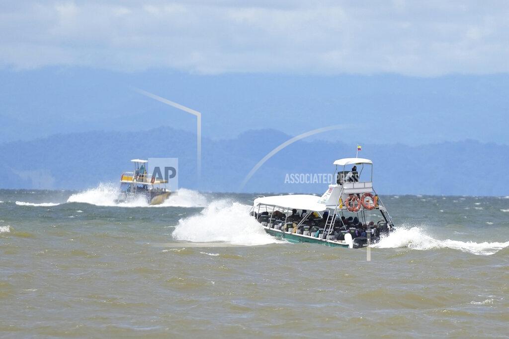 Fernando Vergara Boats take Haitian migrants to Acandi, near the border with Panama, as they leave Necocli, Colombia, Monday, Sept. 13, 2021. Migrants have been gathering in Necocli as they move north on their way to the U.S. border. (AP Photo/Fernando Vergara)