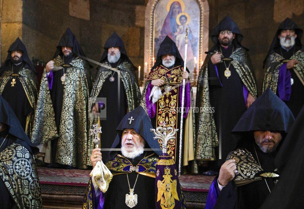 Grigor Yepremyan Armenian Apostolic Church leader Catholicos Garegin II, center, attends a religion service of remembrance of those killed in a war over the Nagorno-Karabakh region, at the Armenian Apostolic Cathedral in Etchmiadzin, the seat of the Oriental Orthodox church outside Yerevan, Armenia, Monday, Sept. 27, 2021. Azerbaijan and Armenia are marking the first anniversary of the start of their six-week war in which more than 6,600 people died and that ended with Azerbaijan regaining control of large swaths of territory. In Yerevan, the Armenian capital, thousands of people went to the Yerablur military cemetery to pay respects to soldiers buried there. (Grigor Yepremyan/PAN Photo via AP)