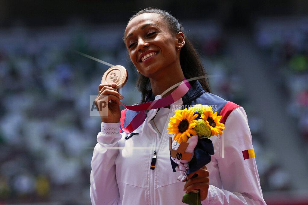 Francisco Seco Ana Peleteiro, of Spain, holds up her bronze medal for the women's triple jump at the 2020 Summer Olympics, Monday, Aug. 2, 2021, in Tokyo. (AP Photo/Francisco Seco)