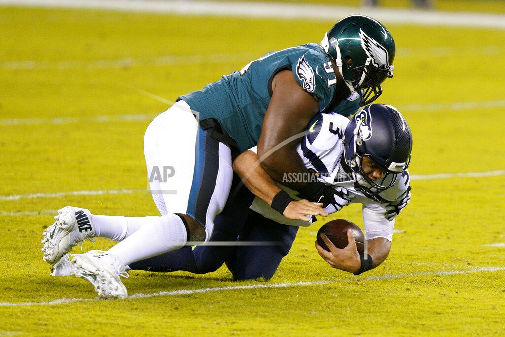 Chris Szagola Philadelphia Eagles' Fletcher Cox (91) tackles Seattle Seahawks' Russell Wilson (3) during the first half of an NFL football game, Monday, Nov. 30, 2020, in Philadelphia. (AP Photo/Chris Szagola)