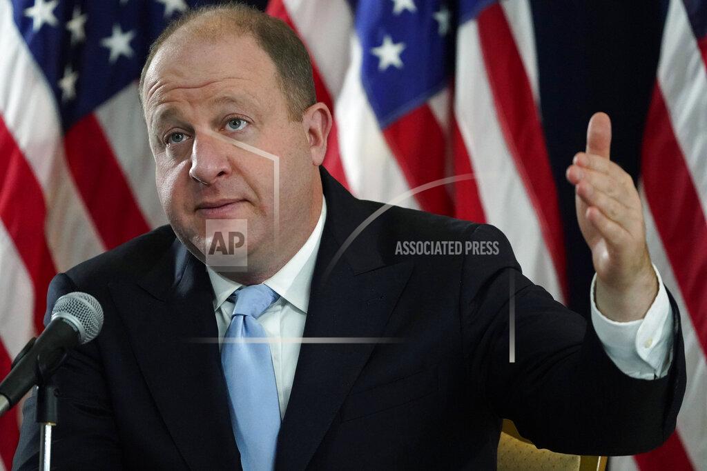 David Zalubowski FILE - In this Tuesday, Nov. 24, 2020 file photo, Colorado Gov. Jared Polis makes a point during a news conference in Denver about the state's response to the rapid increase in COVID-19 cases. Citing Congress' failure to pass a new coronavirus relief package, Colorado's Democrat-led Legislature convened in a special session Monday, Nov. 30 called by Polis to pass bills offering sales tax relief and state grants to small businesses, tenants and public school districts affected by the pandemic.(AP Photo/David Zalubowski, File)