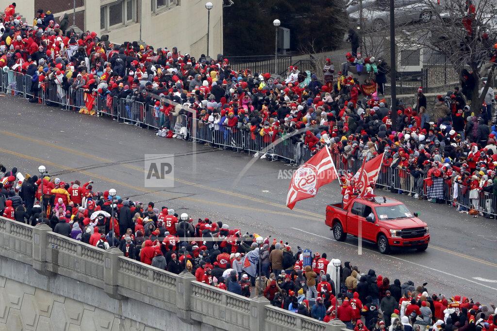 Charlie Riedel A pickup with Kansas City Chiefs flags travels in a parade through downtown Kansas City, Mo. Wednesday, Feb. 5, 2020 to celebrate the Chiefs victory in NFL's Super Bowl 54. (AP Photo/Charlie Riedel)