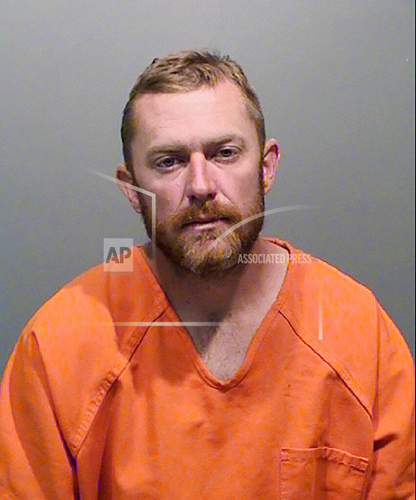 This undated booking photo from the Jefferson County Sheriff's Office shows Eric Breemen, 36. Breemen who is accused of running over the Sikh owner of a suburban Denver liquor store after reportedly telling him and his wife to "go back to your country," is now facing a hate crime charge. Over a dozen charges, including attempted murder, had already been filed against Breemen before prosecutors added the hate crime charge on Tuesday, July 21, 2020. (Jefferson County Sheriff's Office via AP)