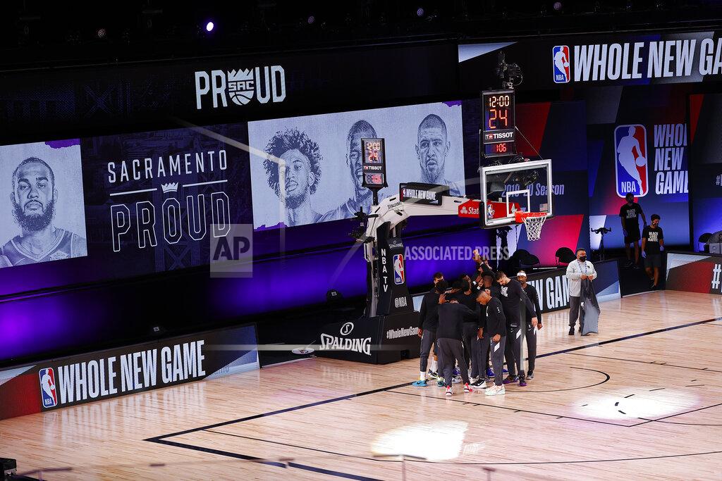 Mike Ehrmann The Sacramento Kings take the court against the New Orleans Pelicans prior to the start of the game of an NBA basketball game Tuesday, Aug. 11, 2020, in Lake Buena Vista, Fla. (Mike Ehrmann/Pool Photo via AP)